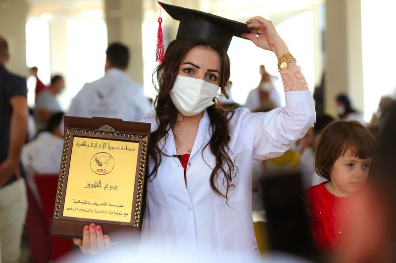 A nursing graduate with her SRD award