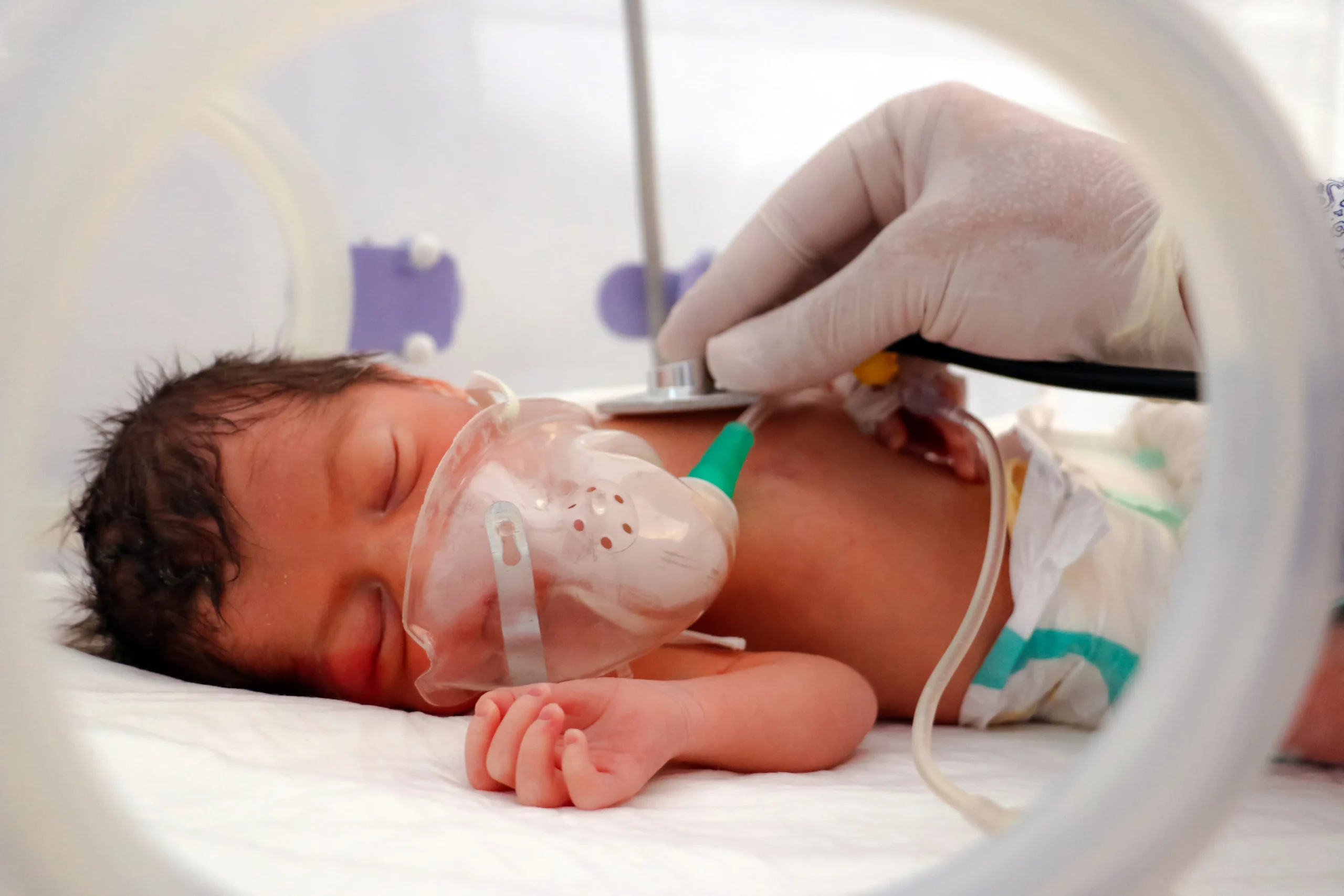 A nurse caring for a newborn